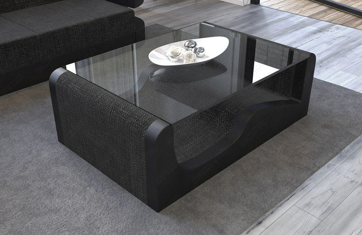 Stoff Couchtisch mit Sicherheitsglasplatte Wave in schwarz-grau - Hugo12 Strukturstoff