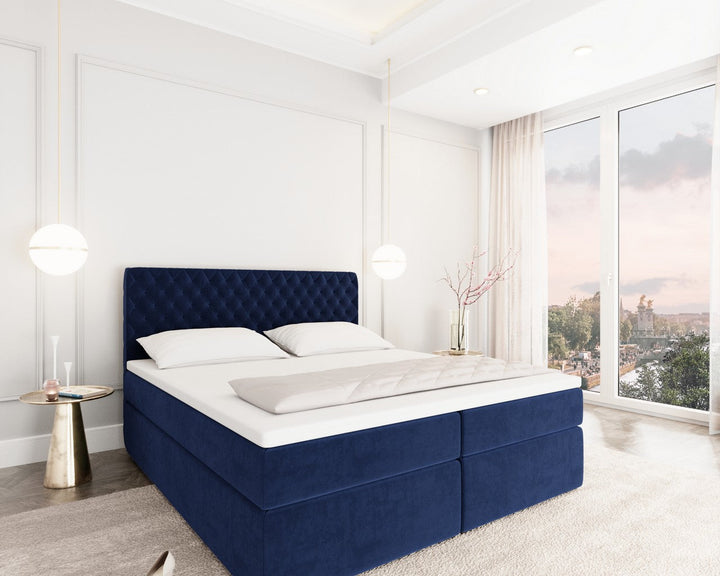 Boxspringbett Mejorada mit Bettkasten als Stauraum in Samt Dunkelblau